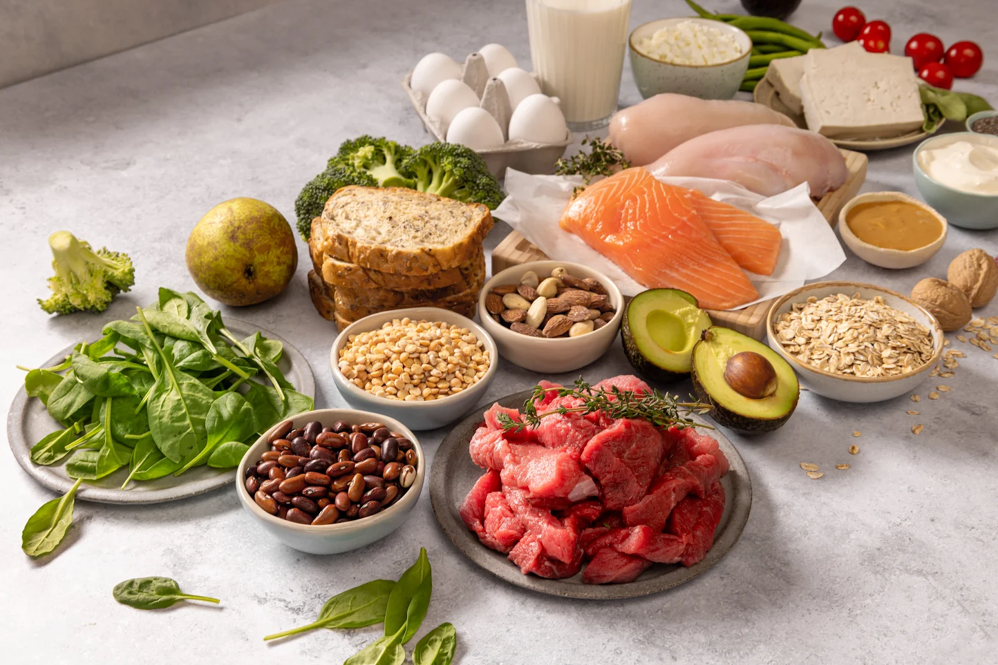 Iron-rich foods including spinach, red meat, beans, salmon and tofu, useful alongside an iron supplement in Singapore